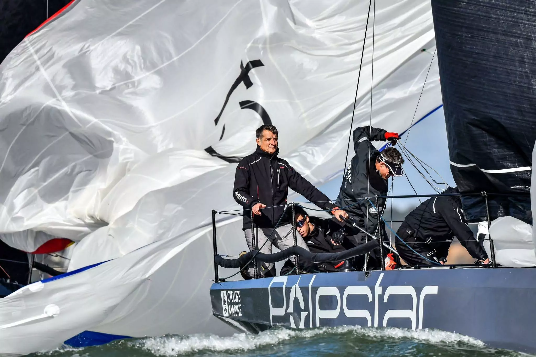 Jonathan Lobert in action with a professional sailing team, illustrating teamwork and shared leadership